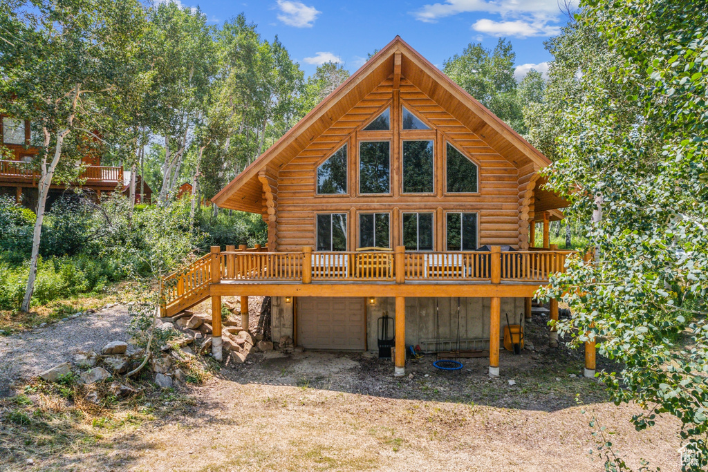 Rear view of house featuring a deck