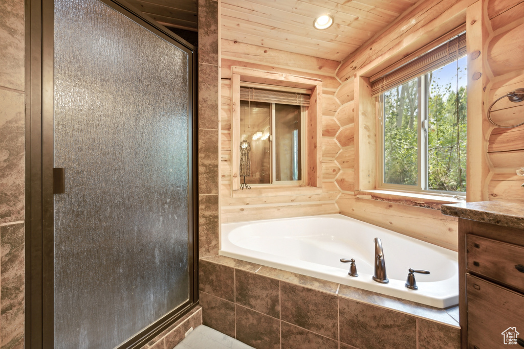 Bathroom with plus walk in shower and vanity