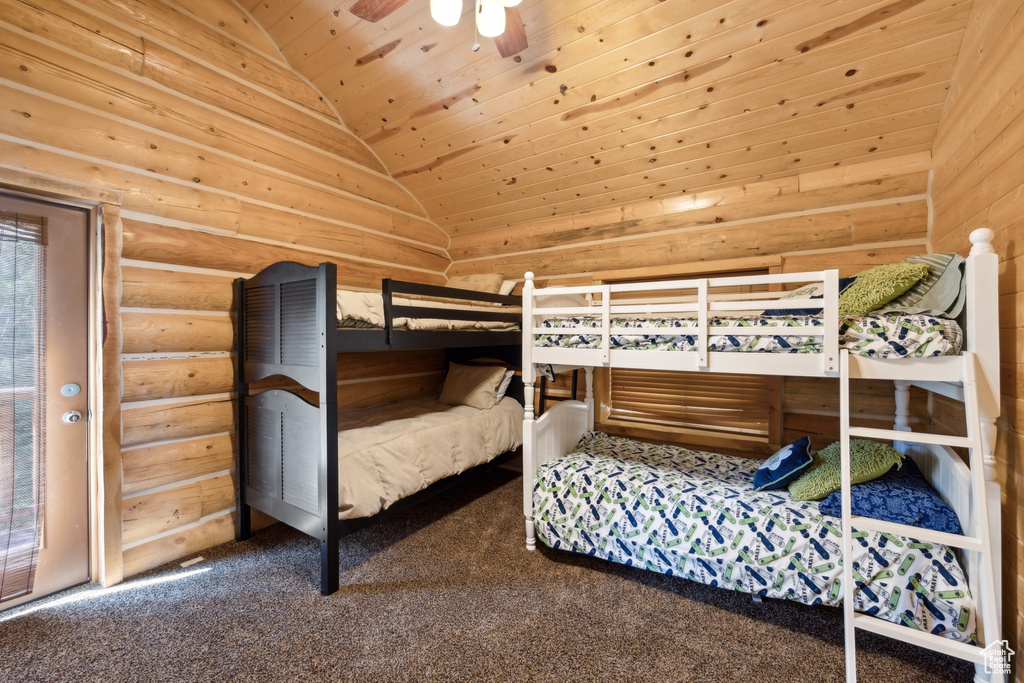 Bedroom with log walls, wood ceiling, carpet floors, lofted ceiling, and ceiling fan