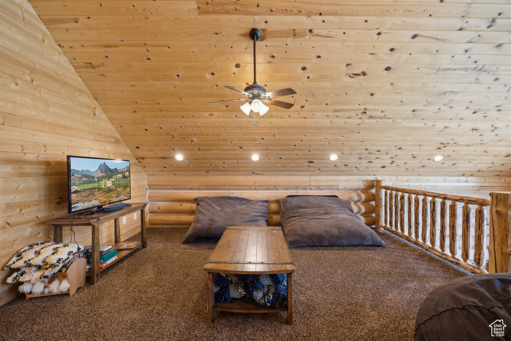 Bedroom featuring carpet, wooden ceiling, and high vaulted ceiling