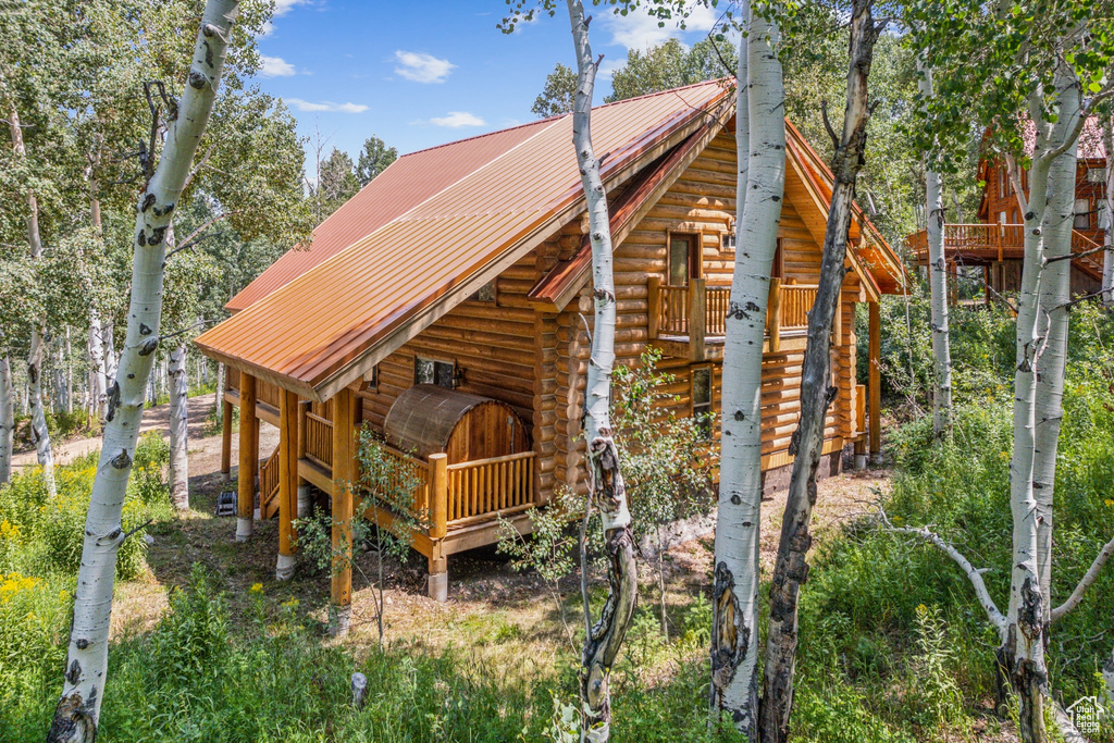 View of property exterior featuring a deck