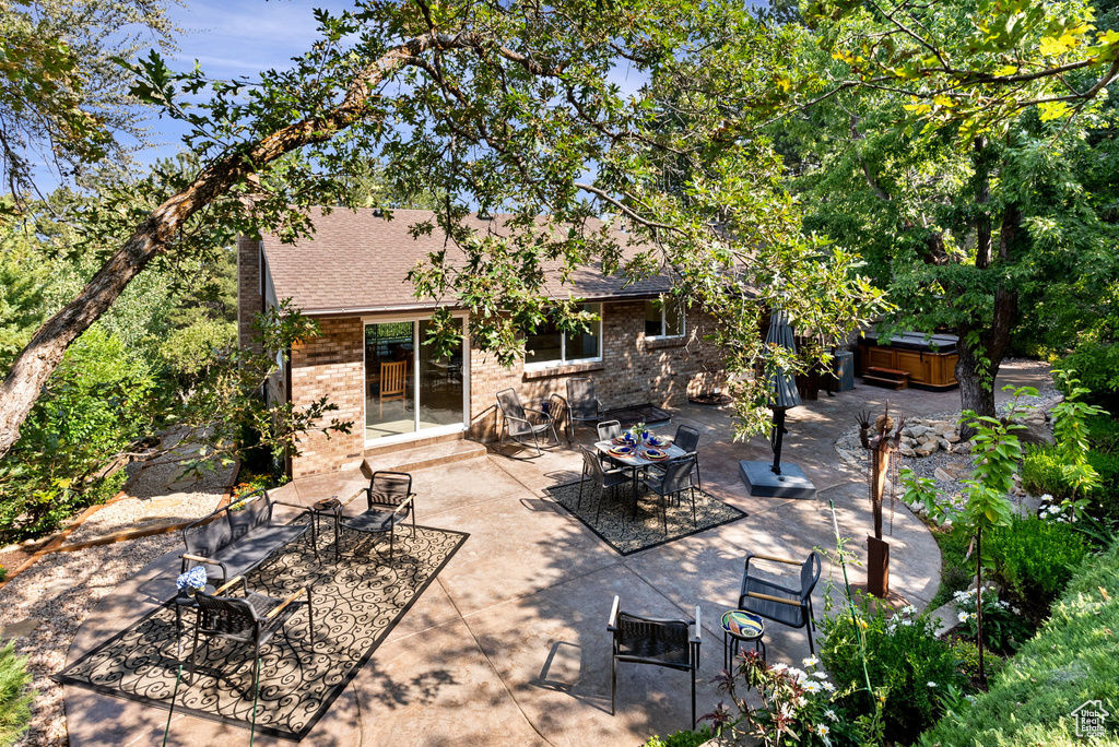 View of patio featuring a hot tub