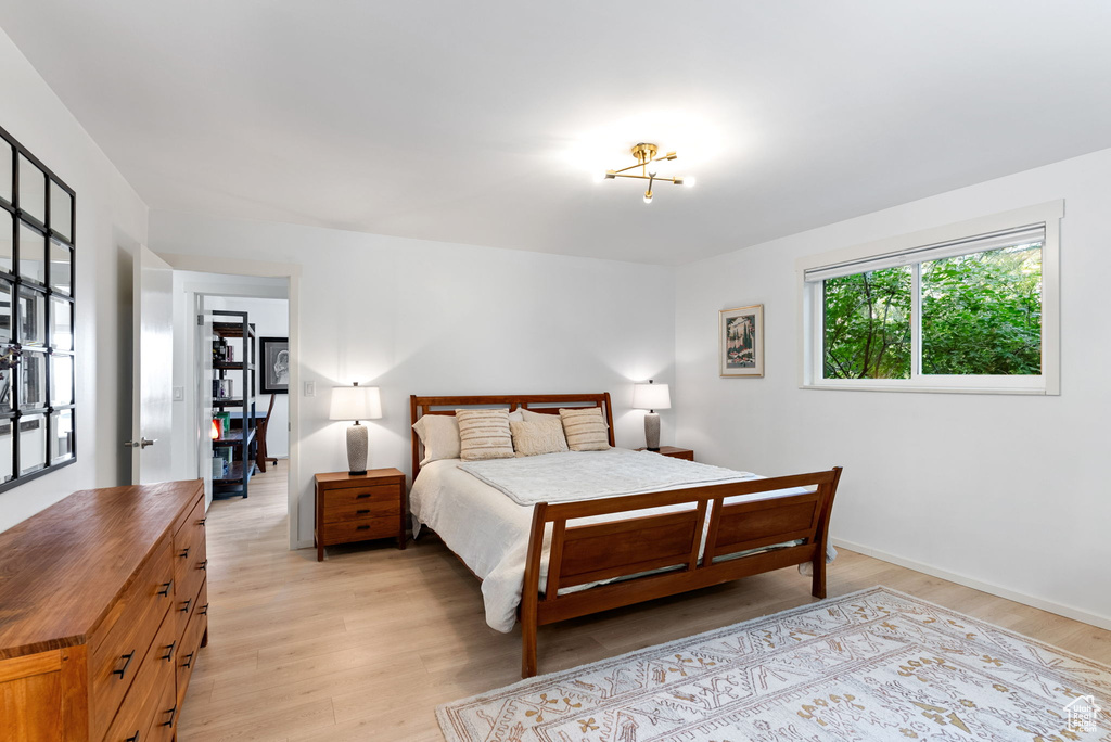 Bedroom with light hardwood / wood-style floors