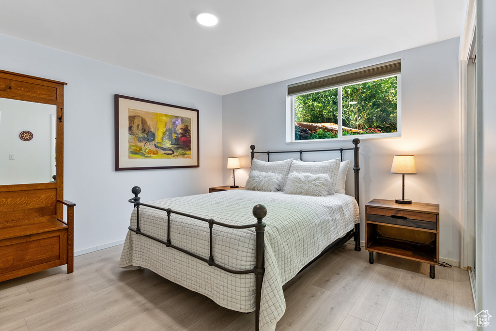 Bedroom with light wood-type flooring