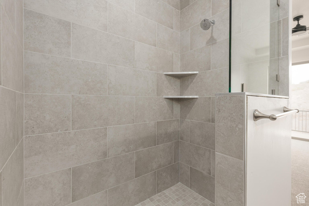 Bathroom featuring a tile shower