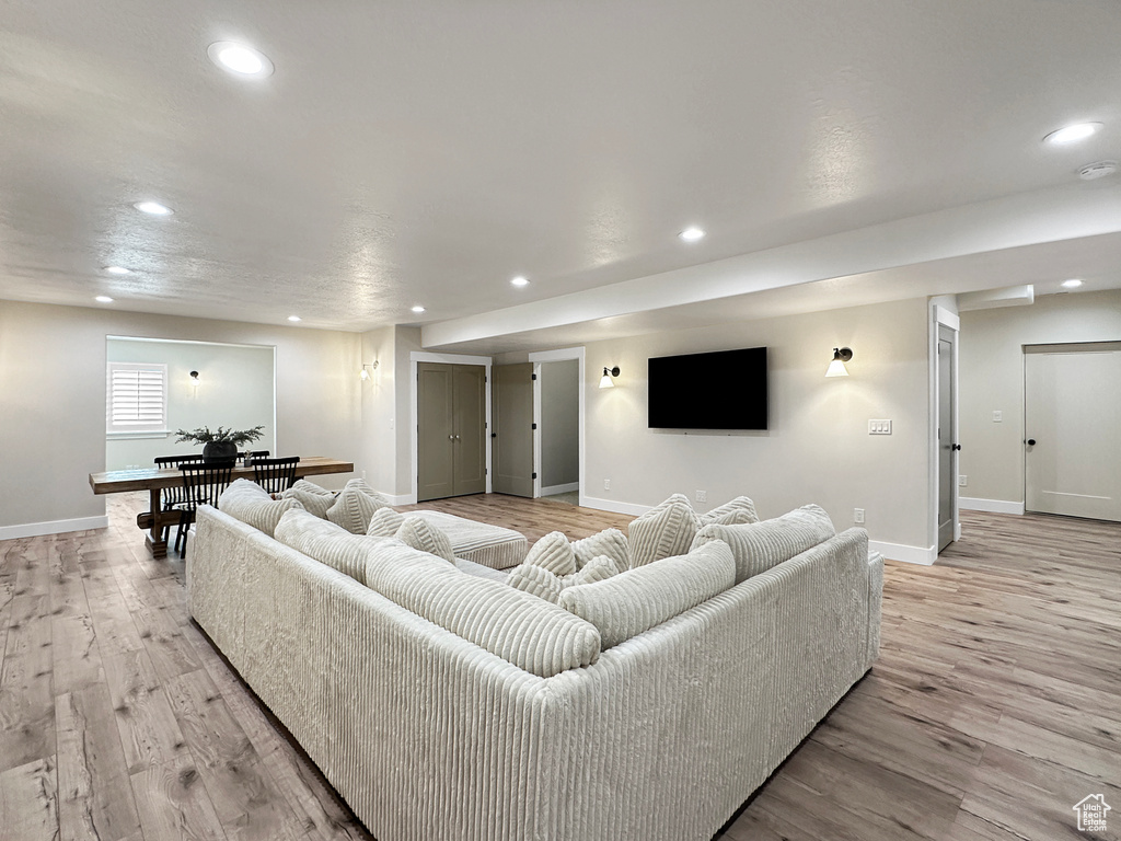 Living room with light hardwood / wood-style floors