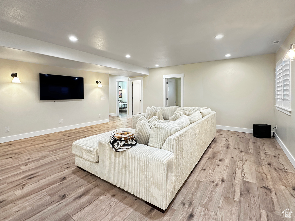 Living room with light wood-type flooring