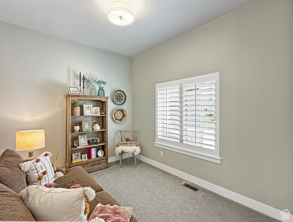 Living area featuring carpet flooring