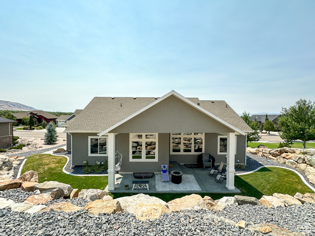 Back of house with a patio area