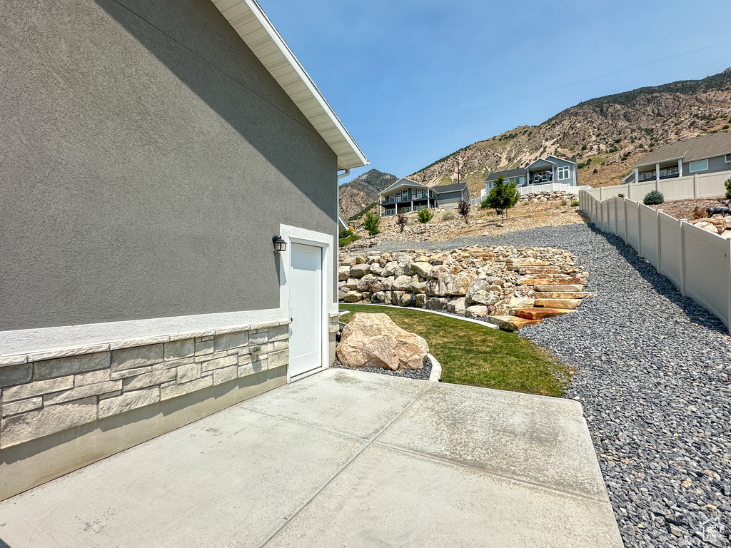 View of yard featuring a mountain view and a patio