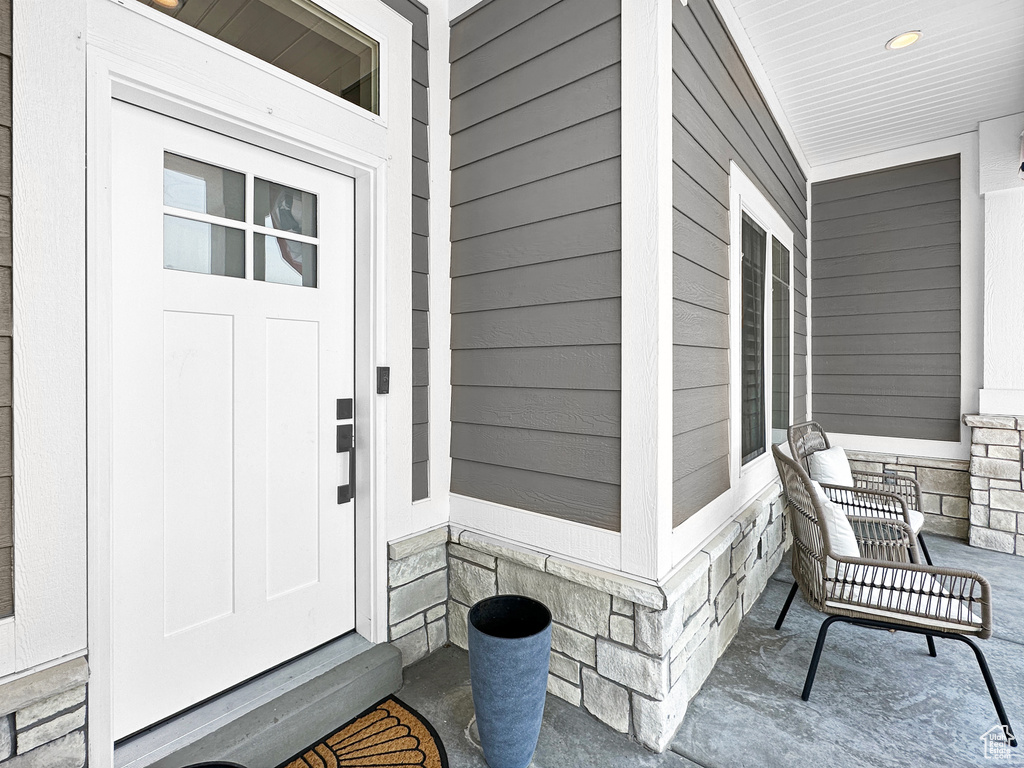 Property entrance featuring covered porch