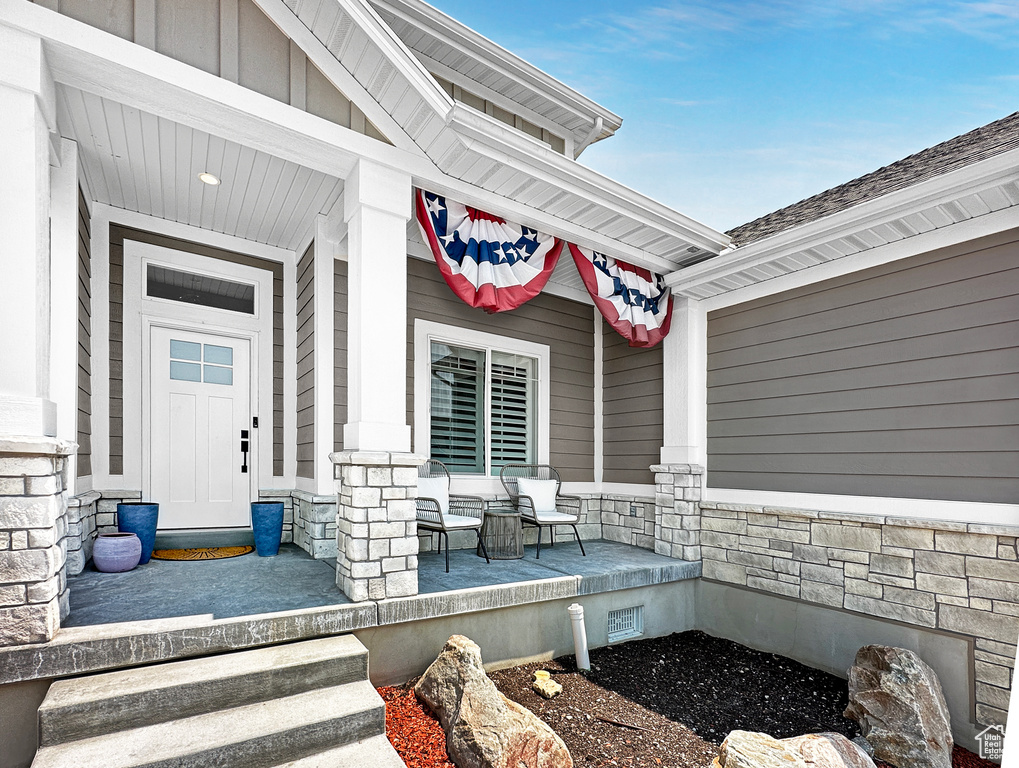 Property entrance with covered porch