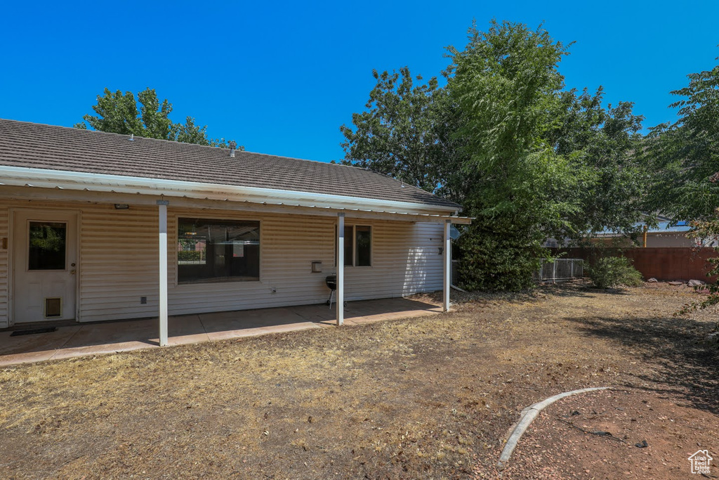 Rear view of house featuring a patio