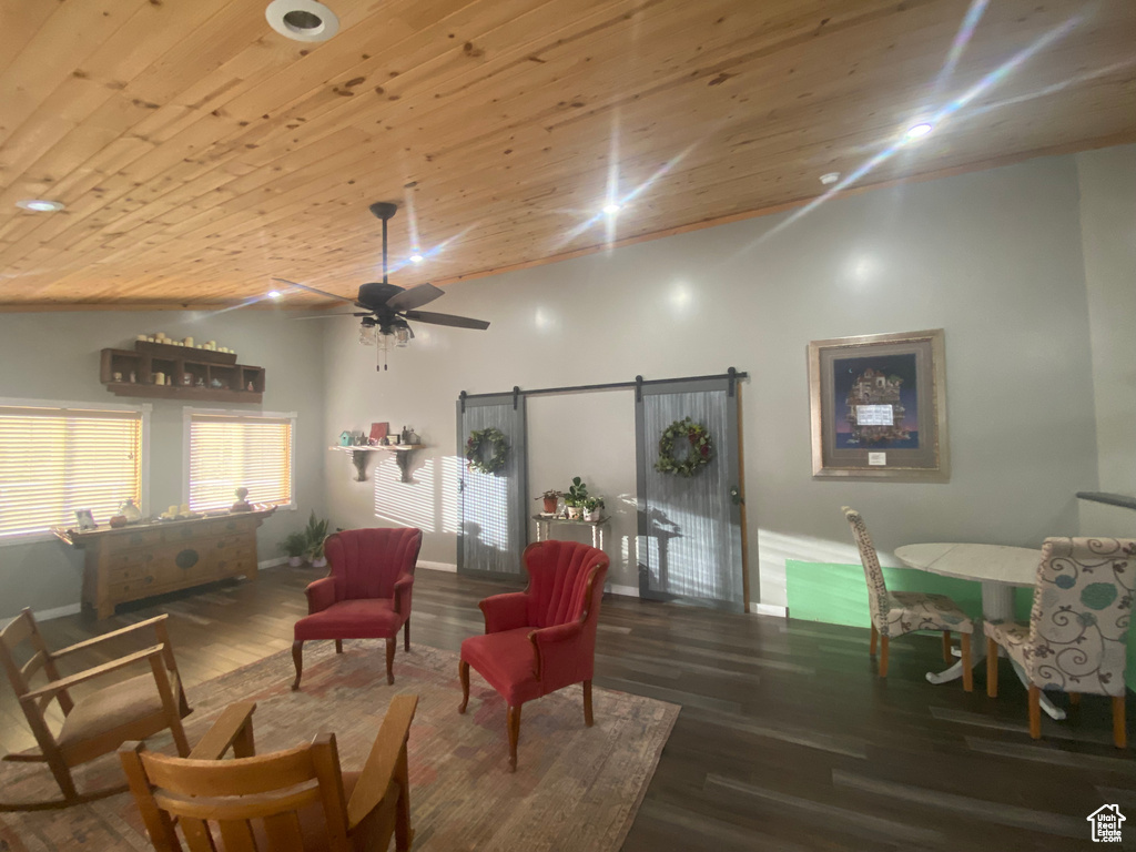 Living room with wood ceiling, ceiling fan, and wood-type flooring