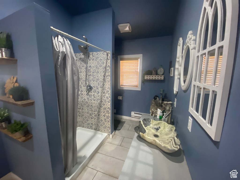 Bathroom with tile patterned flooring