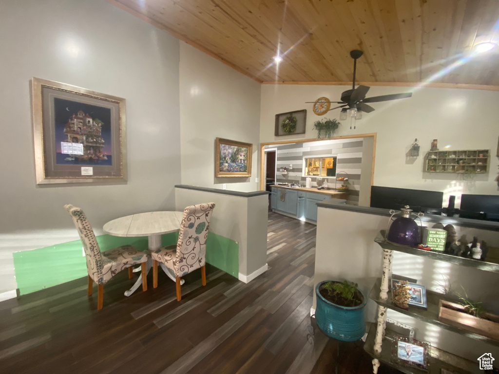 Interior space featuring wood ceiling, high vaulted ceiling, dark hardwood / wood-style floors, and ceiling fan