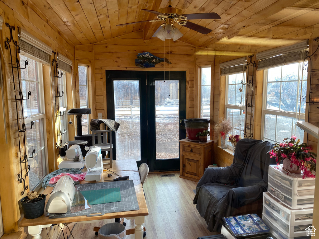 Interior space featuring lofted ceiling, french doors, wood ceiling, and ceiling fan