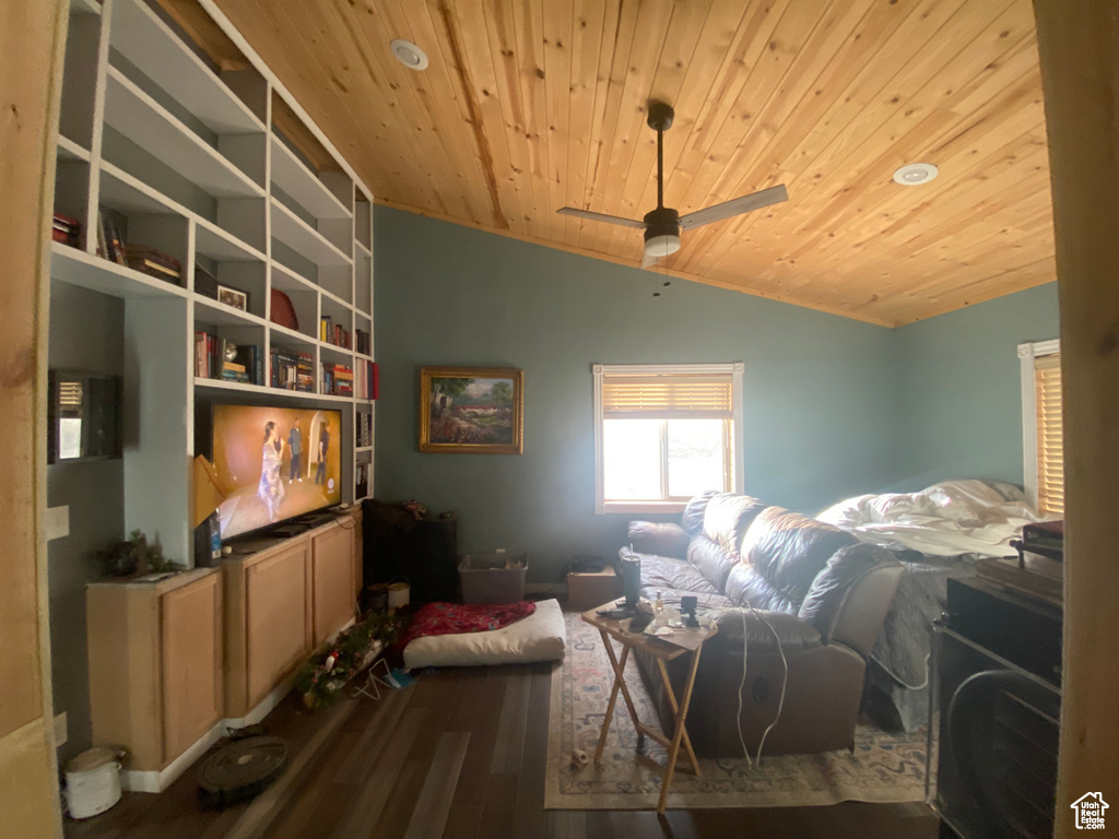 Bedroom featuring wood ceiling, dark wood-type flooring, ceiling fan, and vaulted ceiling