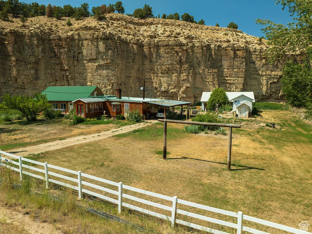 Exterior space featuring a rural view and a front yard