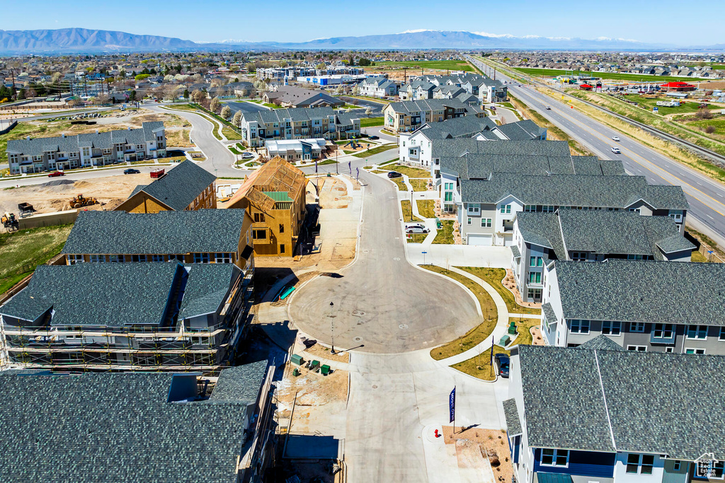 Birds eye view of property with a mountain view