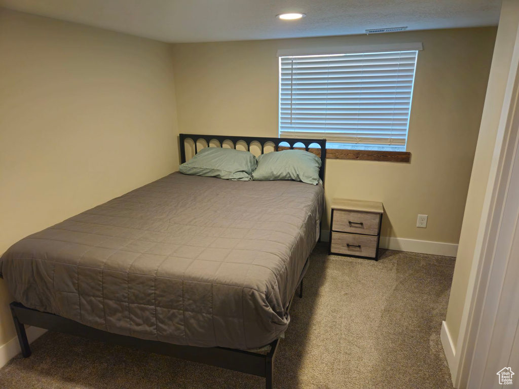 Bedroom with carpet flooring