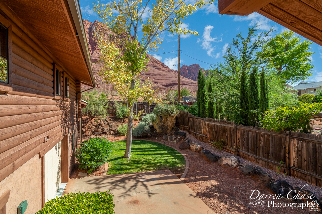 View of yard featuring a patio and a mountain view