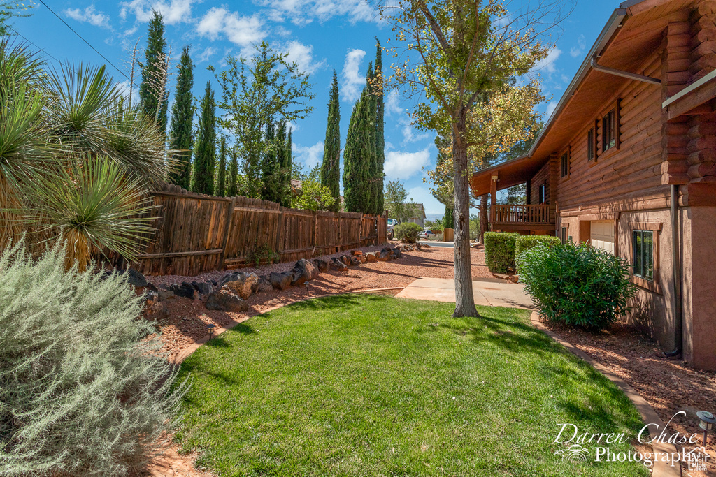 View of yard featuring a wooden deck