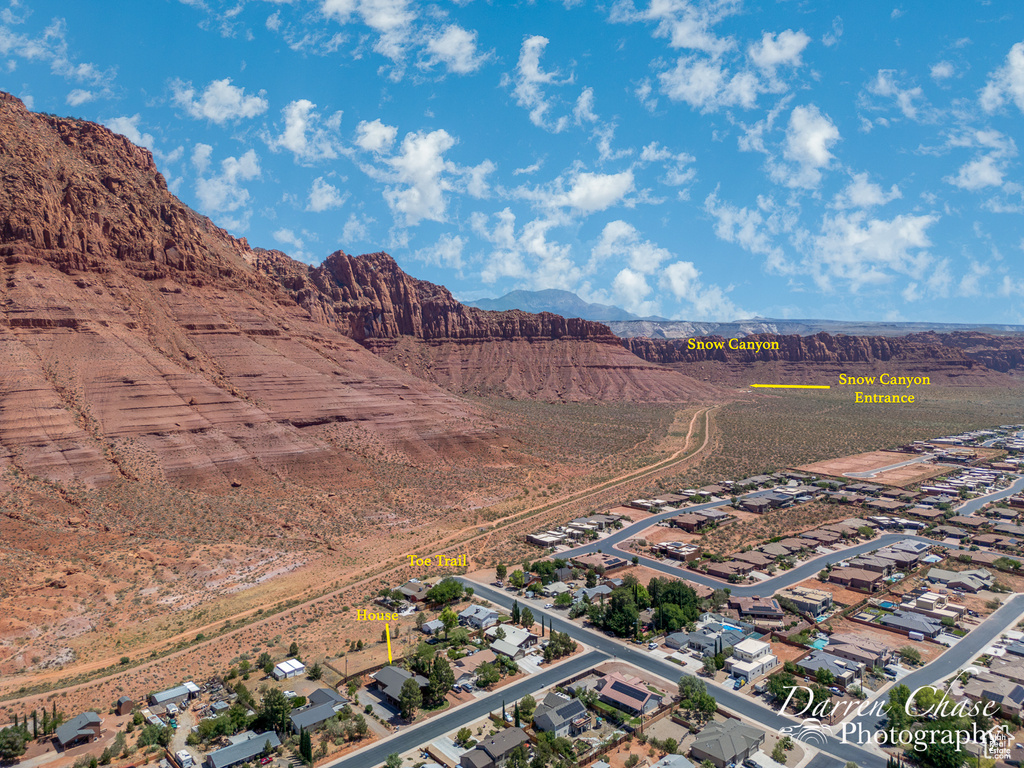 Birds eye view of property with a mountain view