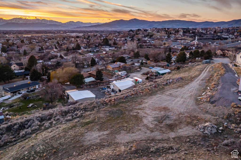 Aerial view at dusk featuring a mountain view