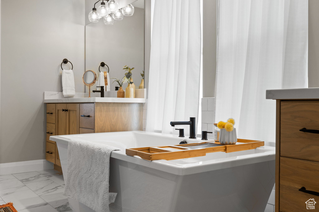 Bathroom featuring vanity and tile patterned floors