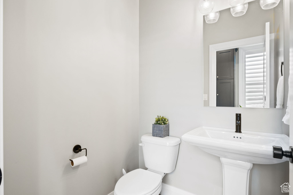 Bathroom featuring sink and toilet