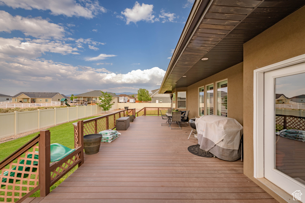 Deck featuring a yard