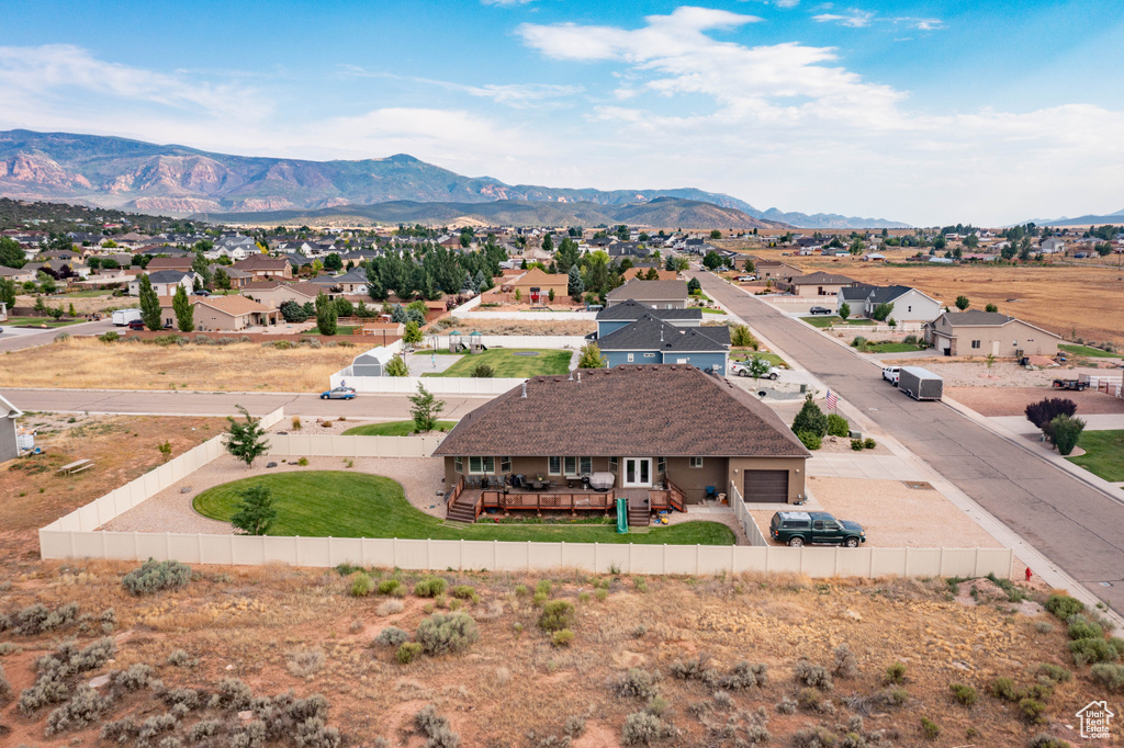 Birds eye view of property with a mountain view