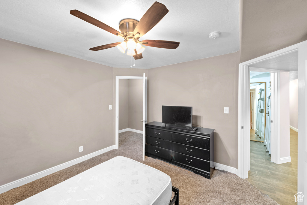 Bedroom featuring carpet and ceiling fan