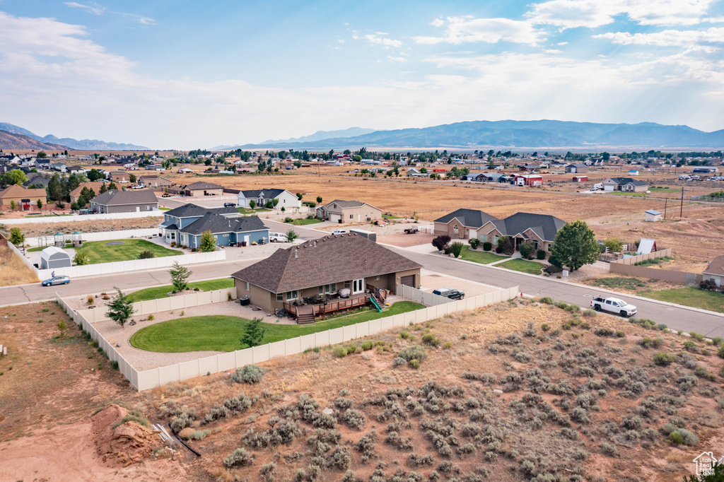 Birds eye view of property with a mountain view