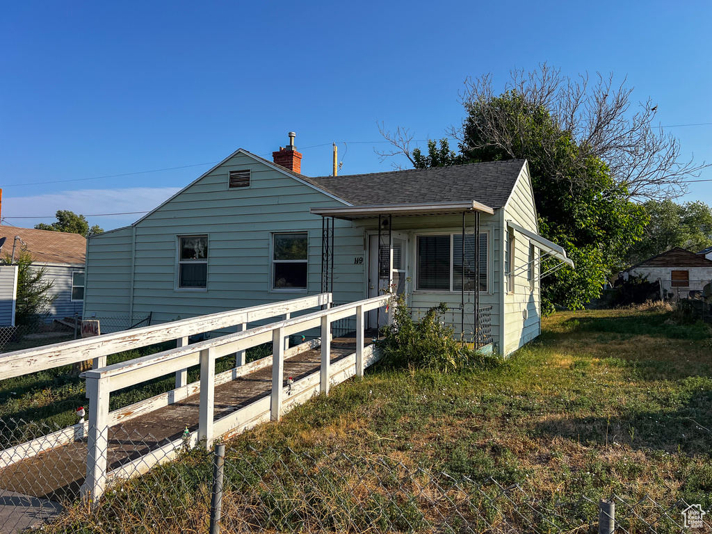 Bungalow-style house featuring a front yard