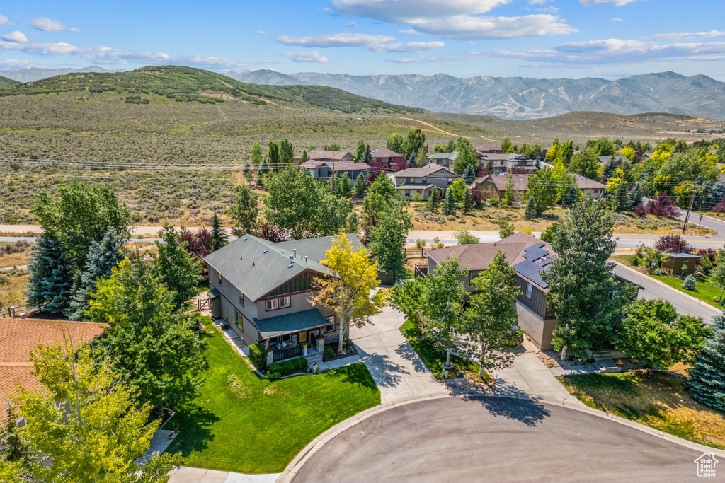 Birds eye view of property with a mountain view