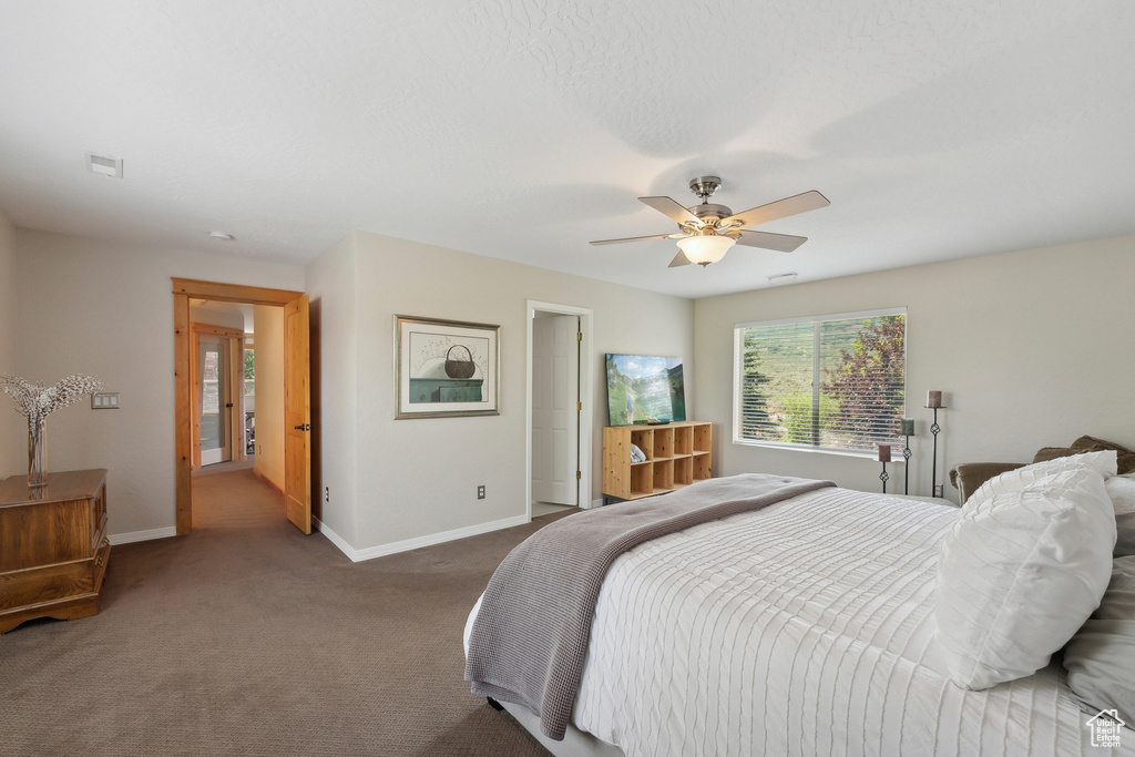 Bedroom featuring carpet floors and ceiling fan