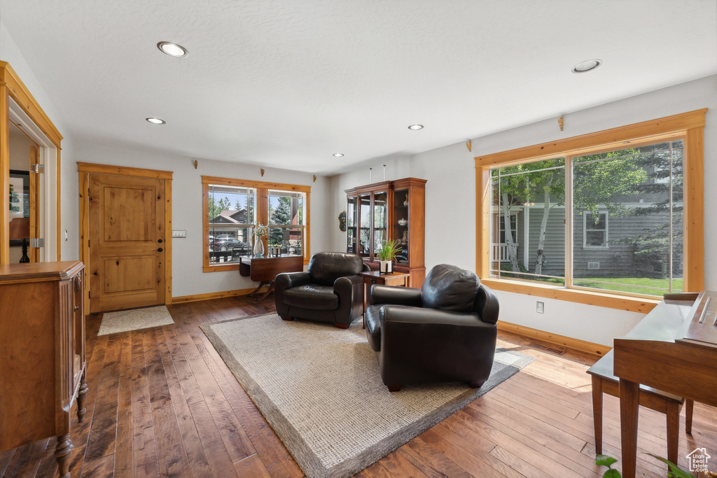 Living room with hardwood / wood-style flooring