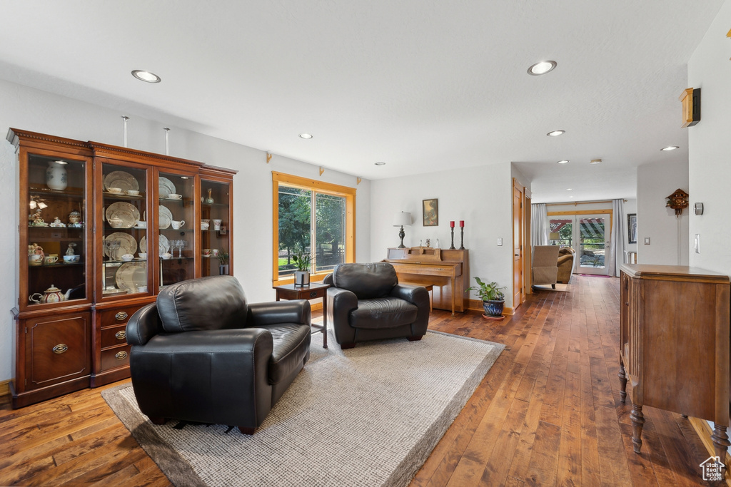 Living room with hardwood / wood-style flooring