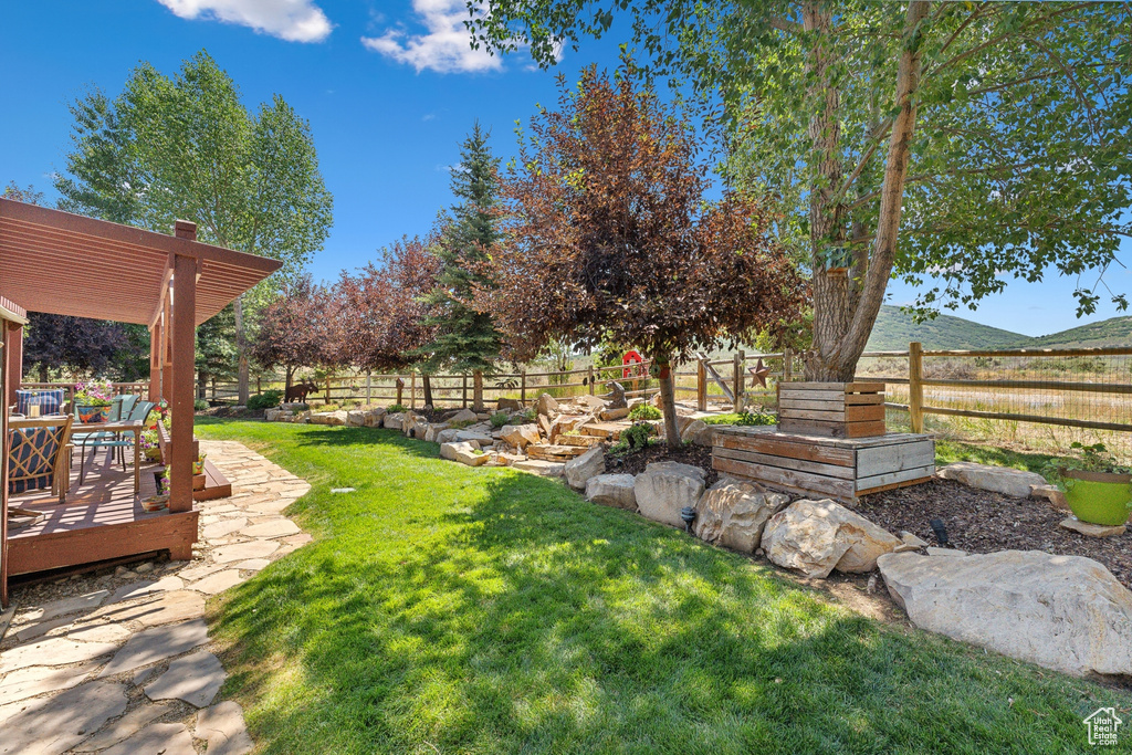 View of yard with a pergola