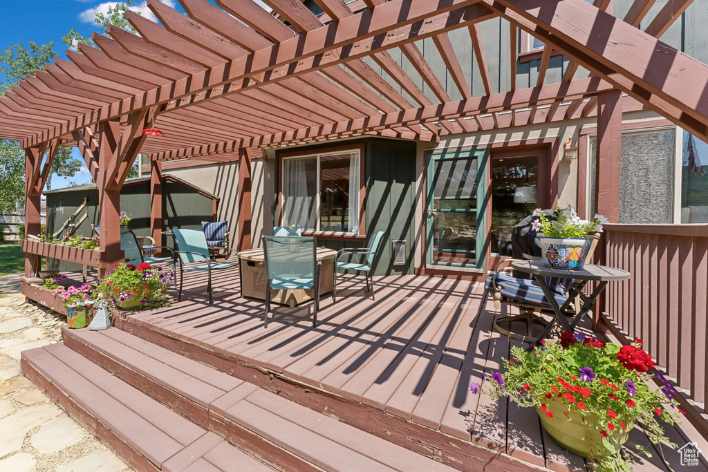 Deck featuring a pergola