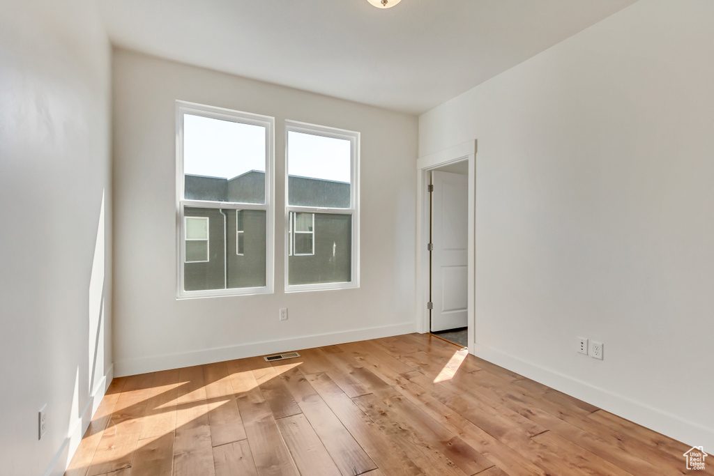 Empty room featuring light wood-type flooring