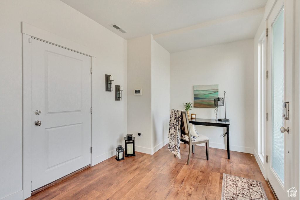 Office with hardwood / wood-style flooring