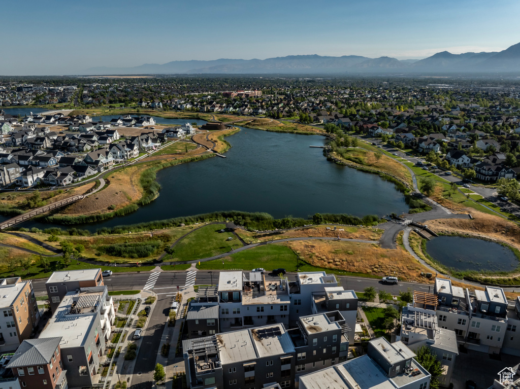 Drone / aerial view with a water and mountain view