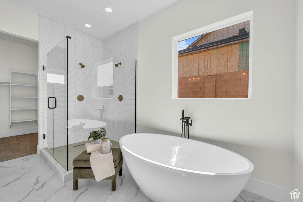 Bathroom featuring plus walk in shower and tile patterned floors