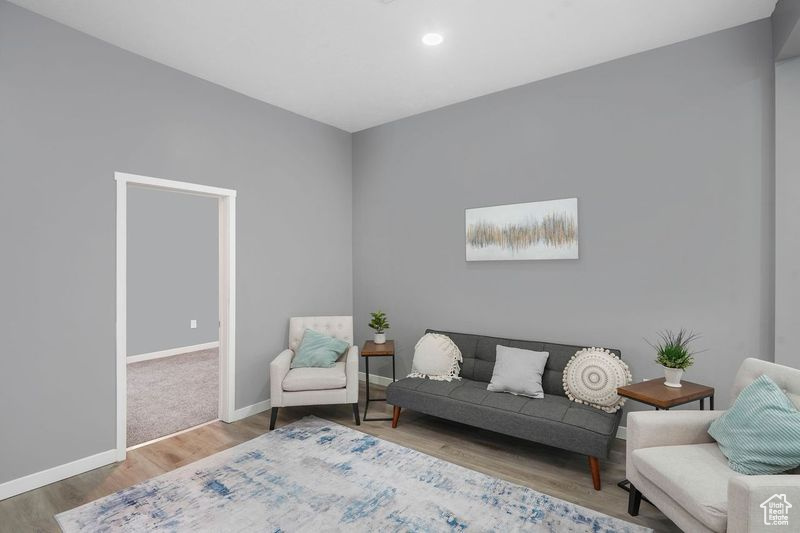 Sitting room featuring hardwood / wood-style floors