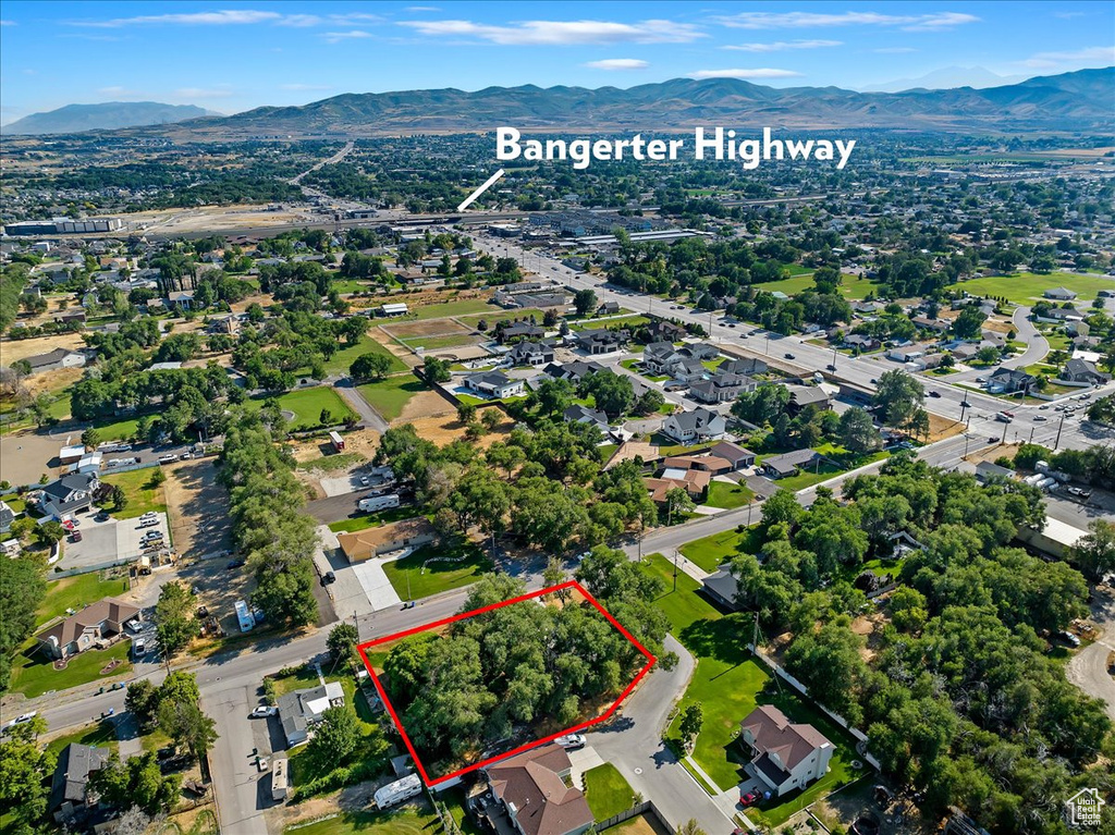 Birds eye view of property with a mountain view