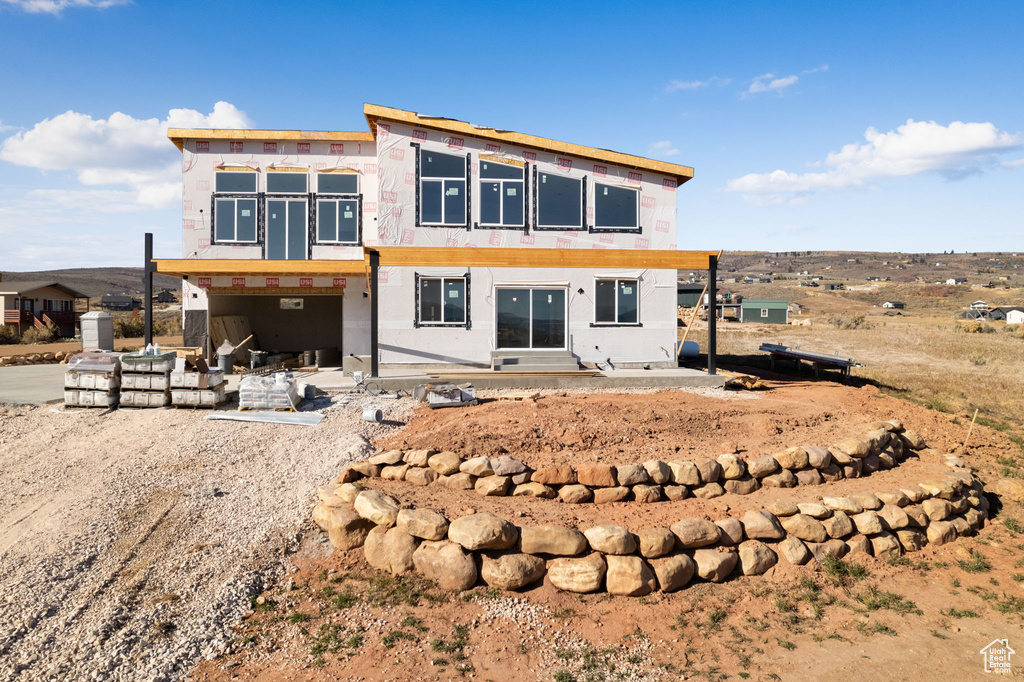 Back of property featuring a patio area