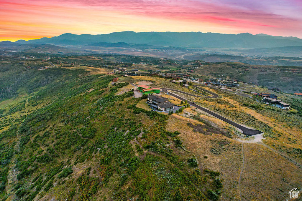 Aerial view at dusk featuring a mountain view